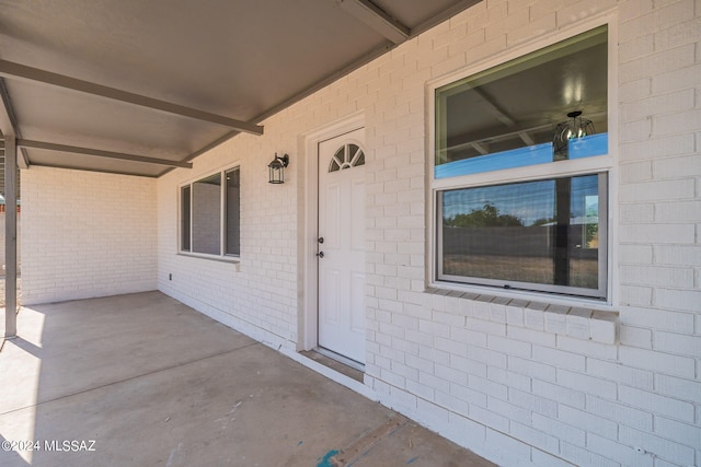 doorway to property with covered porch