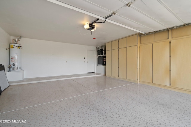 garage with a garage door opener and water heater