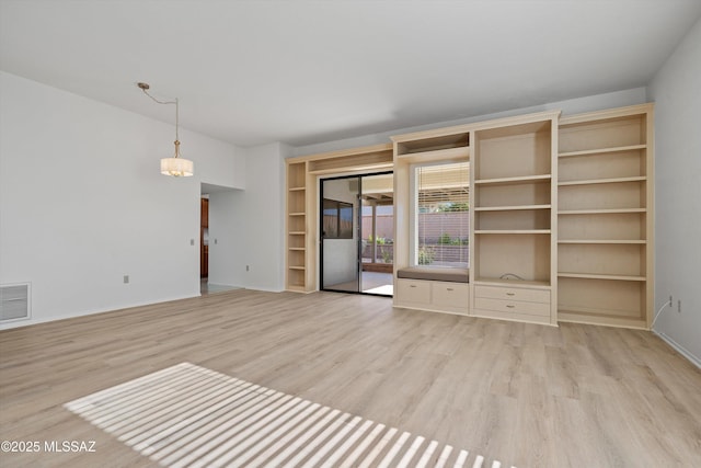 unfurnished living room featuring light hardwood / wood-style floors