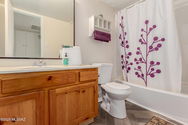 full bathroom featuring shower / bath combo, vanity, toilet, and parquet floors