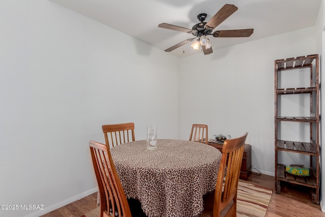 dining room featuring ceiling fan and light wood-type flooring