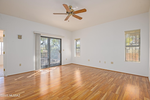 spare room featuring light hardwood / wood-style flooring and ceiling fan