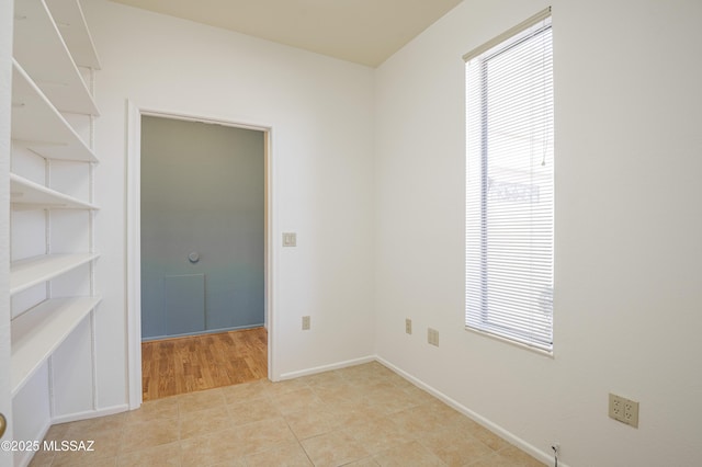 spare room with light tile patterned floors