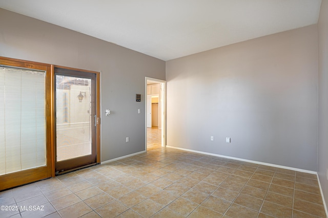 unfurnished room with light tile patterned floors