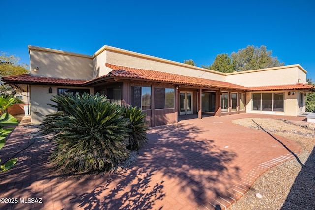 rear view of property with a patio area