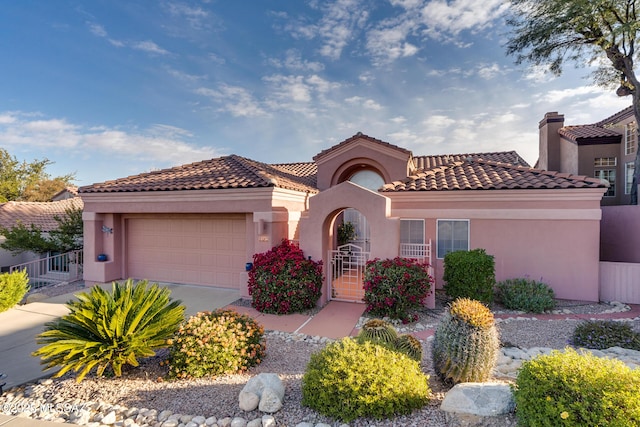 mediterranean / spanish-style home featuring a garage