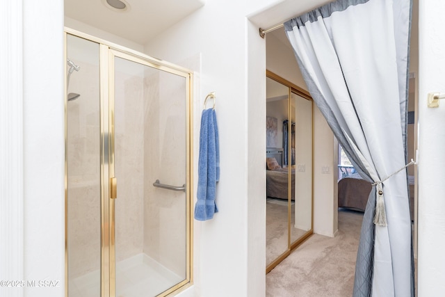 bathroom with lofted ceiling and an enclosed shower