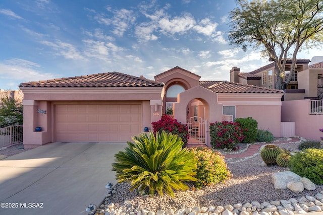 mediterranean / spanish-style home with a garage