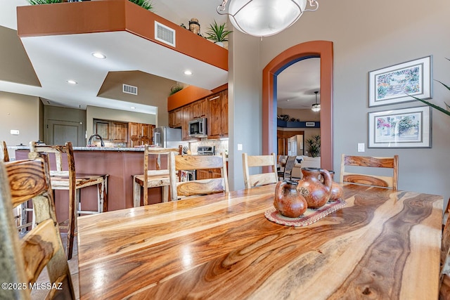 dining space featuring ceiling fan