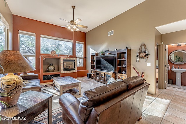 living room featuring sink and ceiling fan