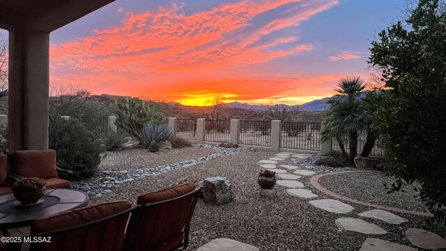 yard at dusk with a mountain view