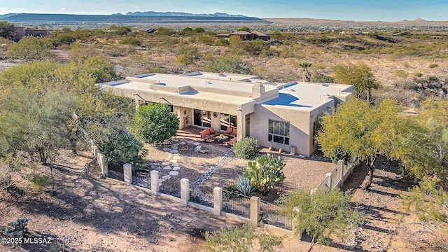 birds eye view of property with a mountain view