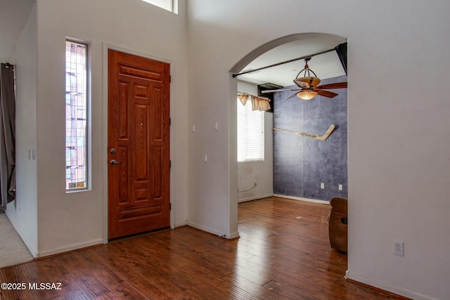 foyer with hardwood / wood-style flooring, ceiling fan, and plenty of natural light