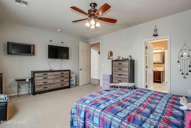 carpeted bedroom featuring connected bathroom and ceiling fan