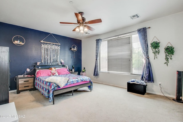 carpeted bedroom with ceiling fan