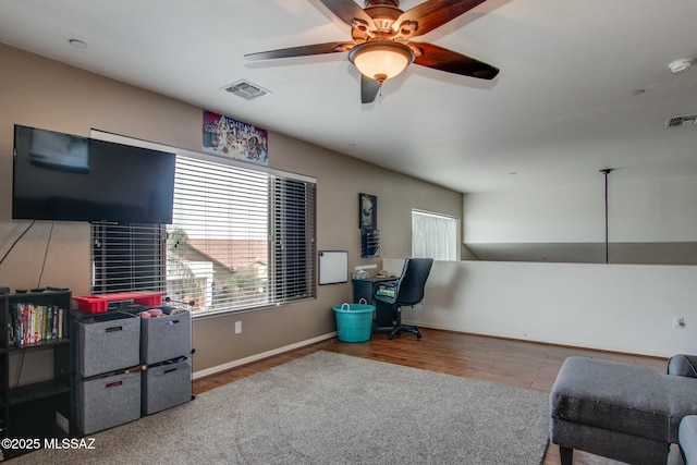 interior space featuring hardwood / wood-style floors and ceiling fan