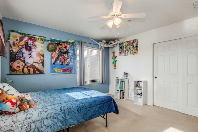 bedroom with carpet floors, a closet, and ceiling fan