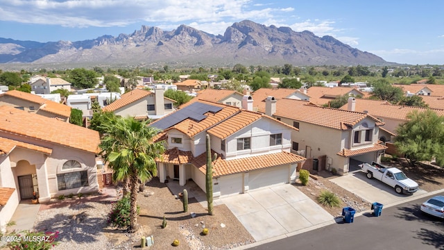 birds eye view of property with a mountain view