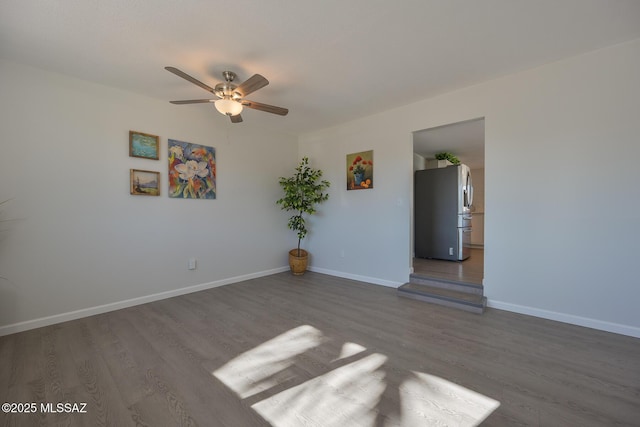 empty room featuring ceiling fan and hardwood / wood-style flooring