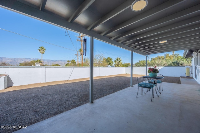 view of patio / terrace featuring a mountain view