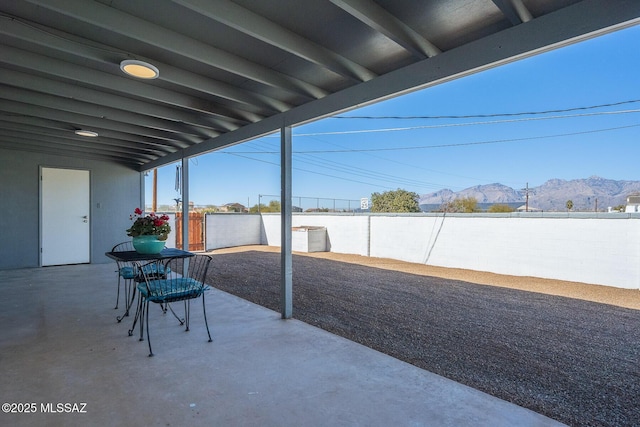 view of patio / terrace with a mountain view