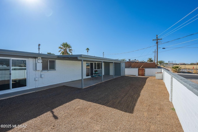 back of house featuring a patio area