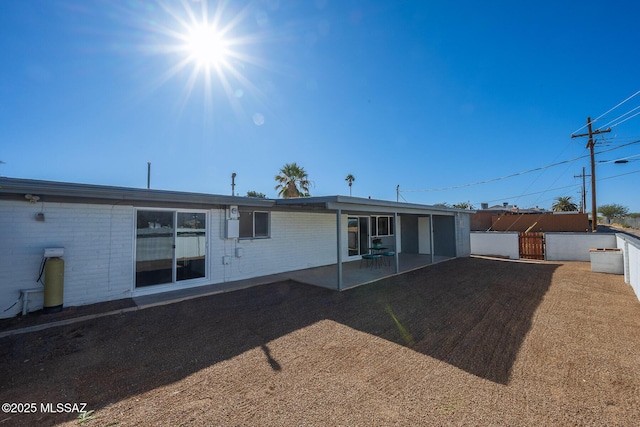 back of property with a patio