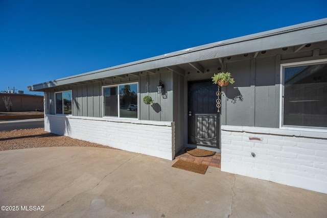 doorway to property featuring a patio