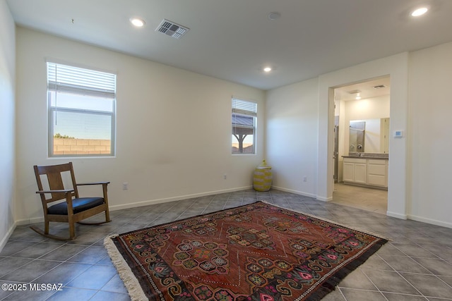 living area with light tile patterned floors