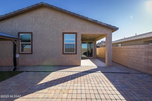 back of house featuring a patio