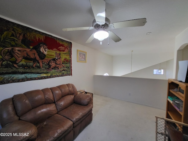 living room with ceiling fan and carpet floors