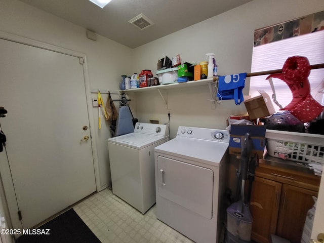 clothes washing area featuring separate washer and dryer