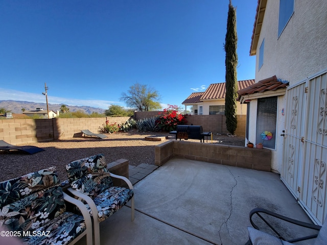 view of patio / terrace featuring a mountain view