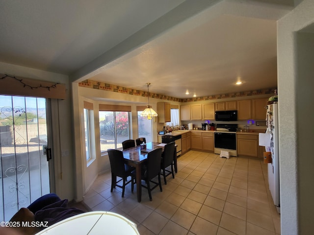 tiled dining room featuring sink