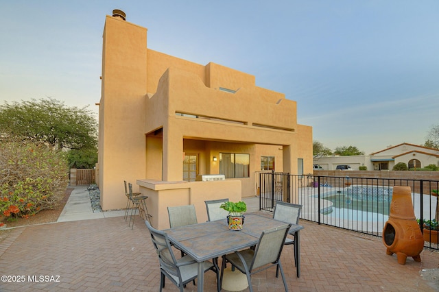 view of patio featuring a fenced in pool