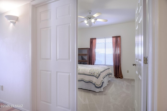 carpeted bedroom featuring ceiling fan