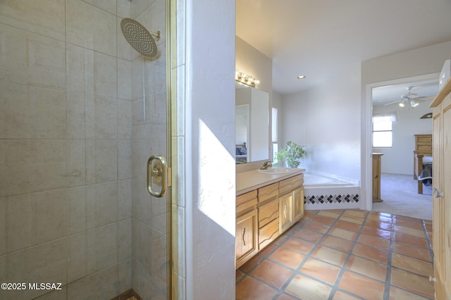 bathroom with vanity, tile patterned flooring, and plus walk in shower