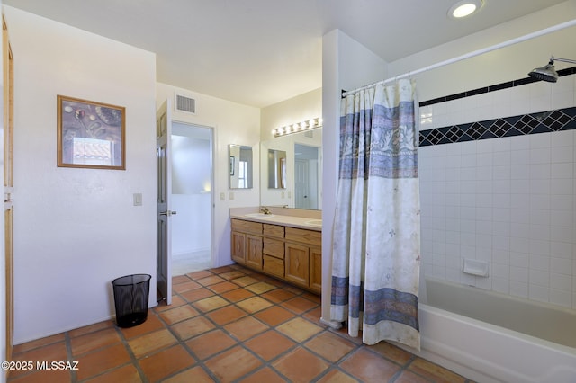 bathroom featuring tile patterned floors, vanity, and shower / bath combo