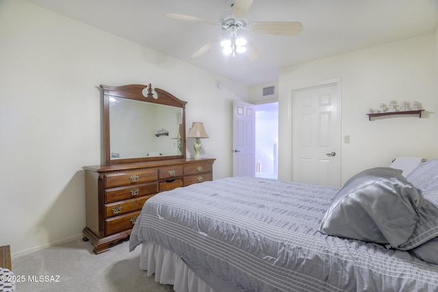 bedroom featuring light colored carpet and ceiling fan