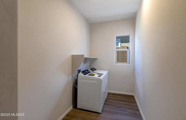laundry room with independent washer and dryer, wood finished floors, laundry area, and baseboards