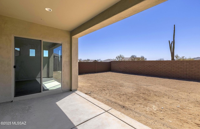 view of yard with a patio and a fenced backyard