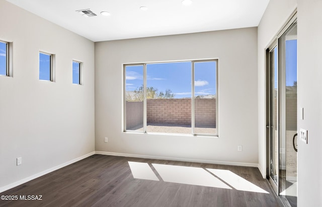 unfurnished bedroom with recessed lighting, visible vents, baseboards, and dark wood-style floors
