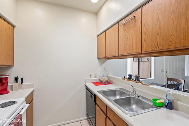 kitchen featuring sink, light tile patterned flooring, and dishwasher