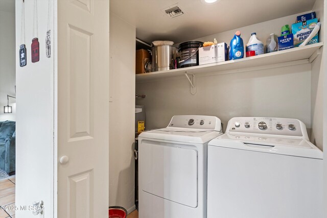 laundry room with washer and dryer