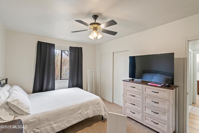 carpeted bedroom with ceiling fan