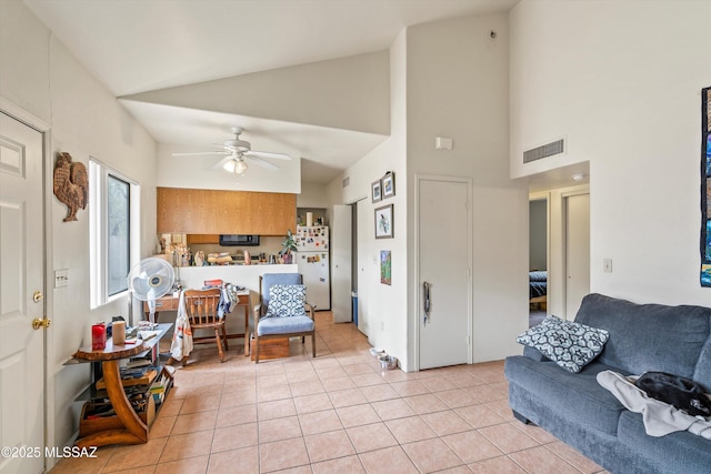 living room featuring high vaulted ceiling, ceiling fan, and light tile patterned floors