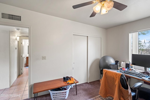 home office featuring ceiling fan and light tile patterned floors