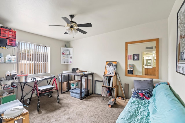 carpeted office with ceiling fan