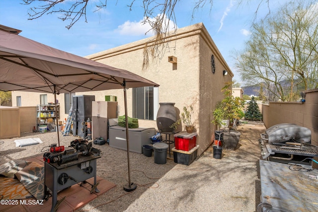 rear view of property featuring a patio area