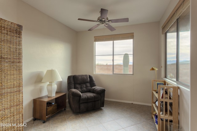 sitting room with ceiling fan